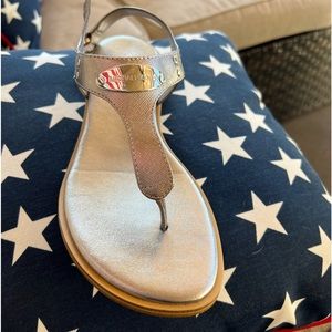 Michael Kors sandals brand new. Silver/sterling color. Never worn. New in box.